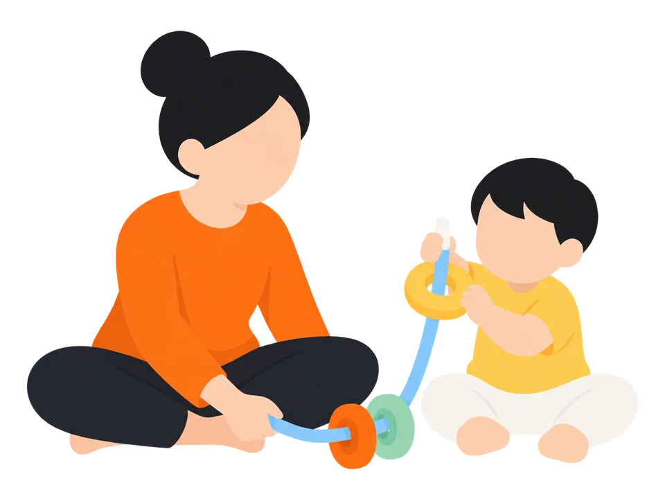 2. 子どもにひもの先を持たせ、リングを渡します。大人はひもの反対の端を持って支えます。