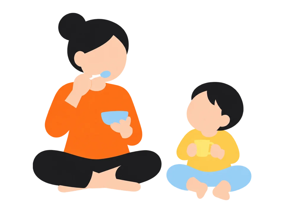 1. 大人がスプーンを口もとに運んで、「もぐもぐ、おいしい」と食べるまねを見せます。