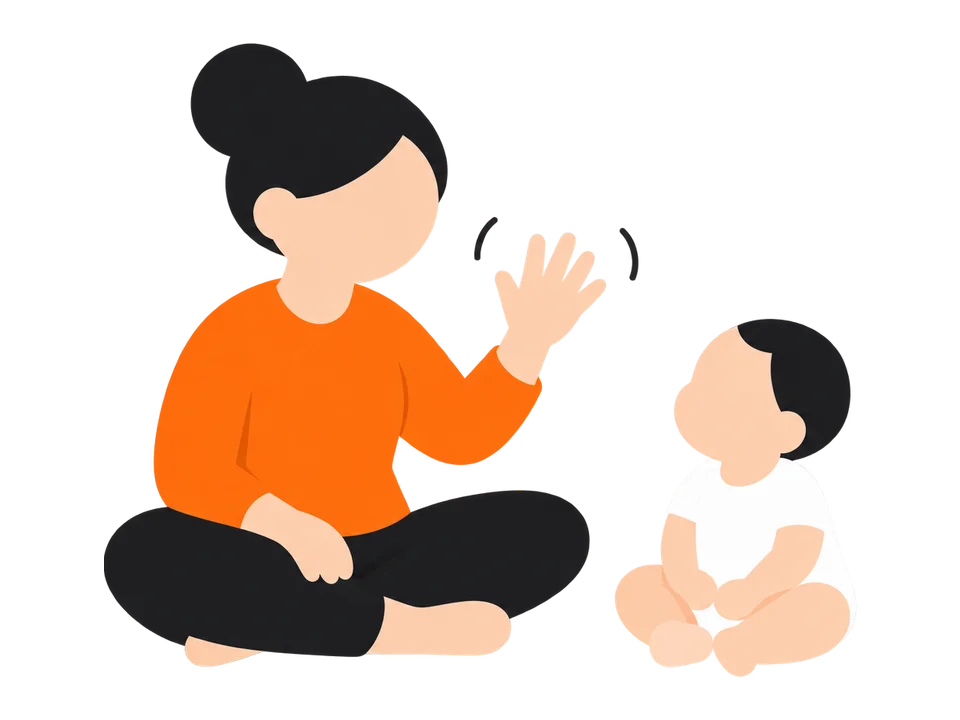 1. 向かい合って座り、大人がバイバイや拍手など、簡単な動きをゆっくり見せます。