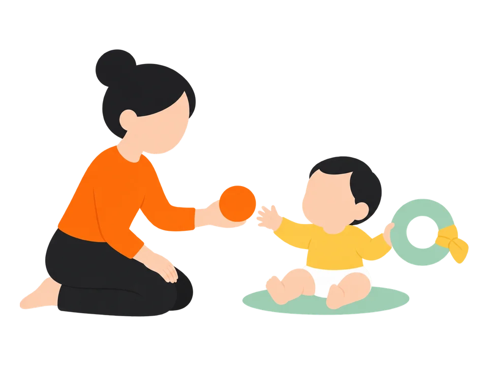 3. おすわりができるころには、反対の手の近くにも別のおもちゃを差し出してみます。