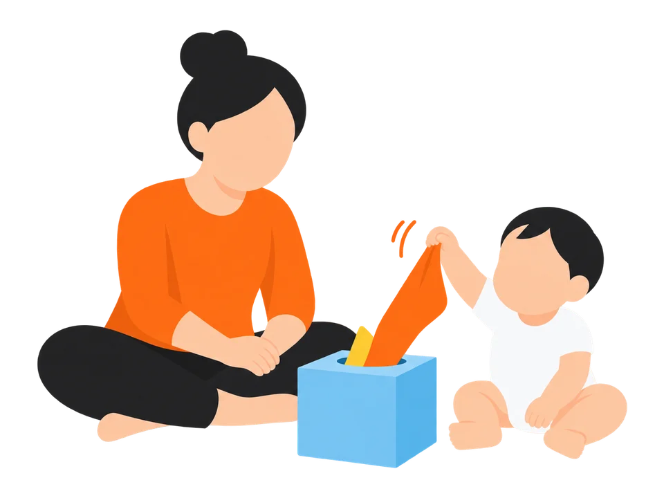 2. 端を引っぱると出てくるのを見せて、子どもにも引いてもらいます。