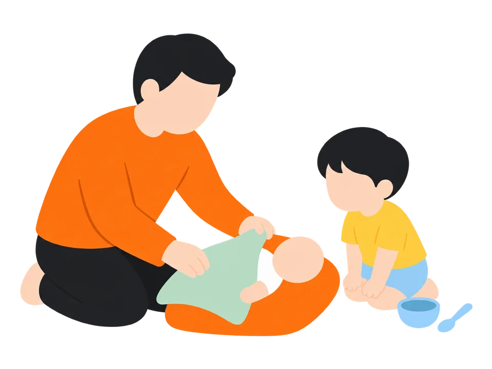 1. 大人が人形に「ねんねしようね」とハンカチをかけて見せます。