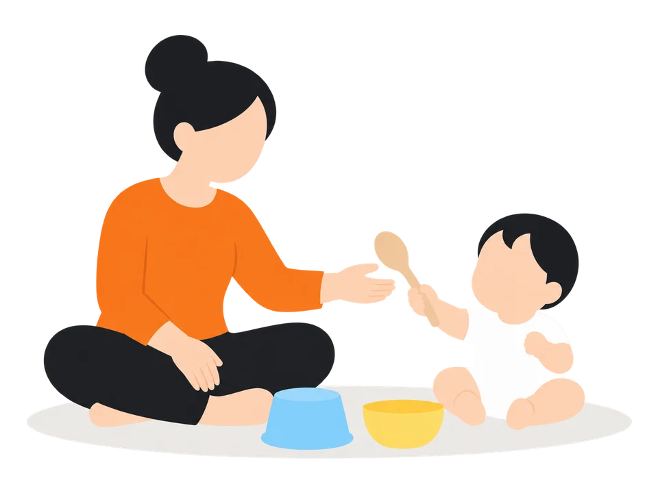 2. 子どもにスプーンを渡します。